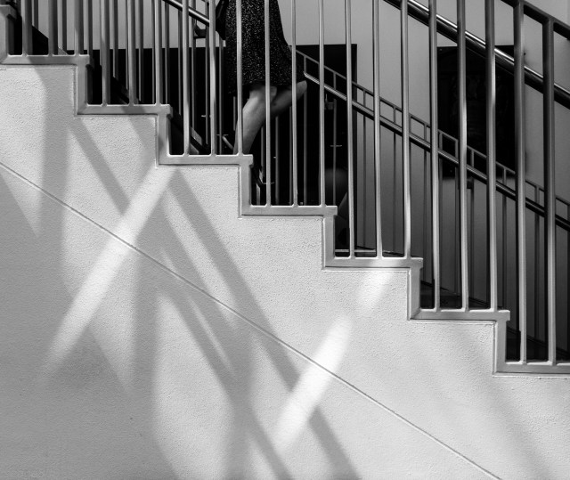 a woman ascends the stairs